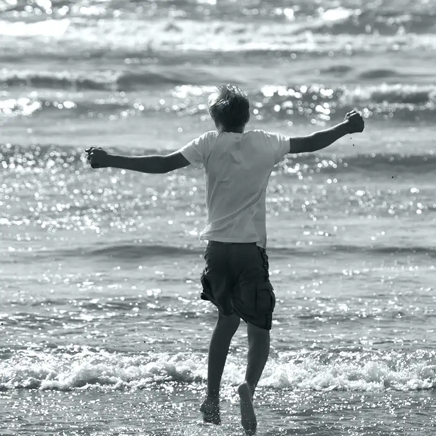 Christopher Beach Jump BW Kid Jumping on the Beach